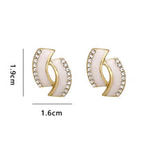Elegant Gold Earrings with White Accents and Rhinestone Detailing