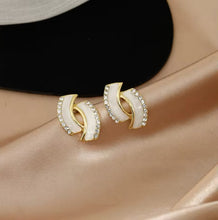Elegant Gold Earrings with White Accents and Rhinestone Detailing