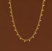 Elegant Gold Necklace with Beaded Accents