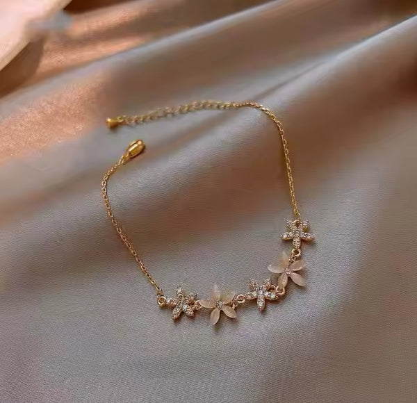 Delicate Gold Flower Bracelet with Sparkling Stones