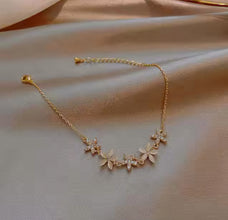 Delicate Gold Flower Bracelet with Sparkling Stones