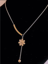 Gold-Tone Stainless Steel Necklace with Floral Pendant and Curved Bar Design